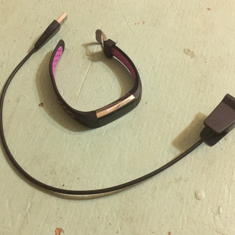 FitBit Alta with charger cord